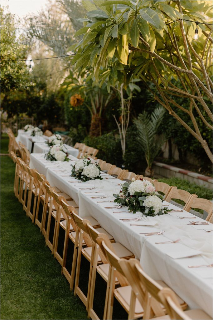 cozy backyard reception tablescape at backyard palm springs wedding venue