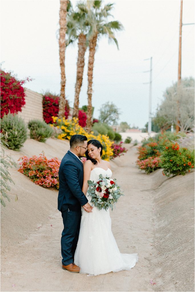 wedding couple standing in front yard at backyard palm springs wedding venue