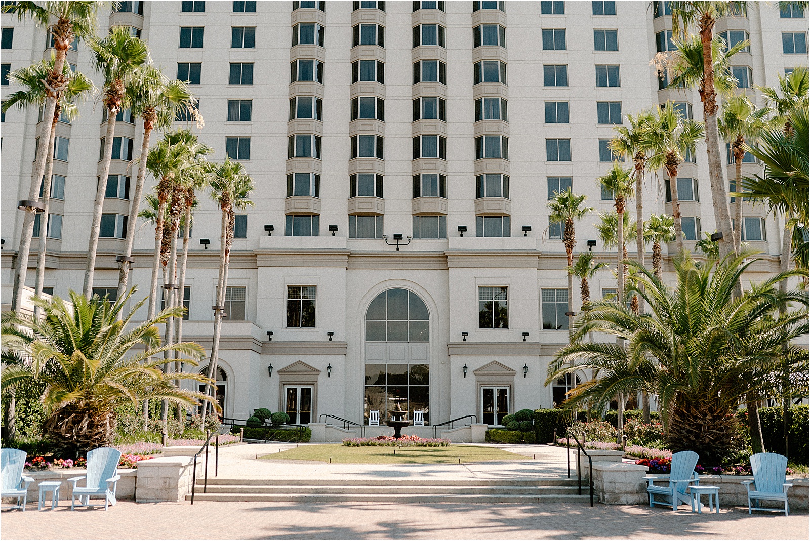 The Westin Savannah River lawn with palm trees and florals in the garden